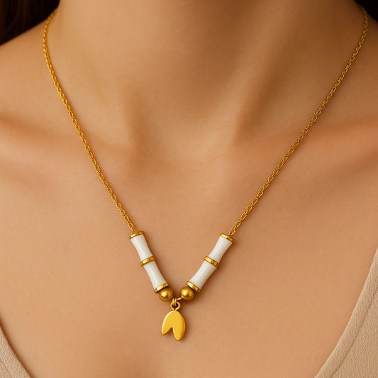 Golden Elephant Charm Necklace with White Ceramic Beads